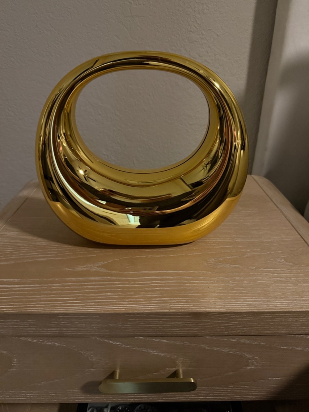 Gold Oval Statement Clutch